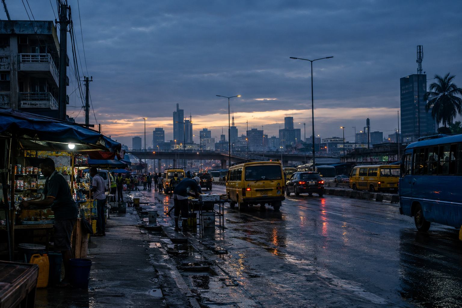 City buses at dusk with skyline behind
