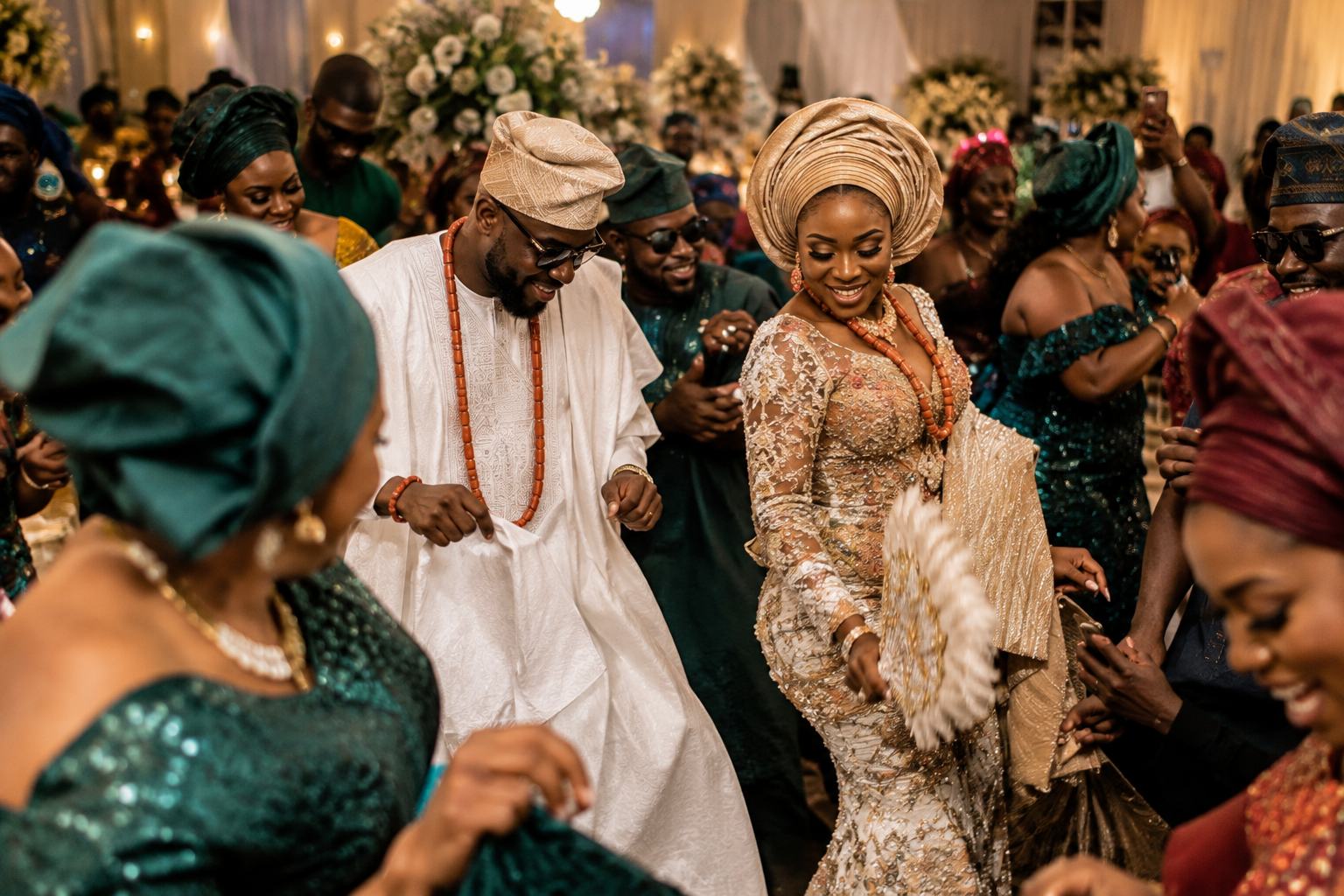 Wedding guests dancing in traditional attire
